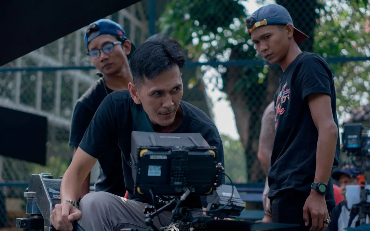 A team reviewing footage on a screen